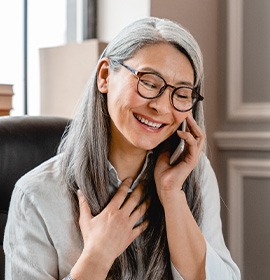 A middle-aged woman talking on a cell phone