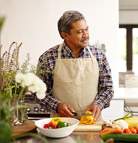 An older couple preparing healthy food to eat