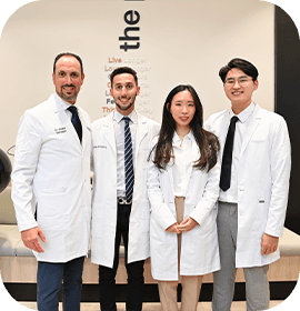 Four Brampton dentists smiling at Salvaggio Dentistry