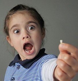 Shocked boy covers his mouth when visiting Brampton emergency dentist