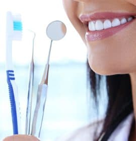 woman smiling dental tools