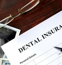 Insurance paperwork for the cost of dental implants in Brampton