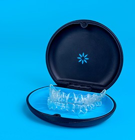 Invisalign trays in black and blue carrier case