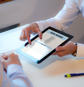 Patient reviewing dental insurance form on tablet
