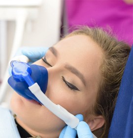 woman relaxing with nitrous oxide dental sedation in Brampton