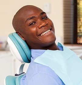 Smiling woman in dental exam chair