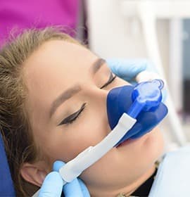 Woman with nitrous oxide nasal mask