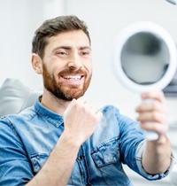 Man with dental implants in Brampton