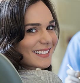 Smiling woman in dental chair