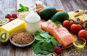 fresh vegetables and other food on table