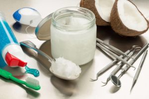 coconut oil alongside dental tools