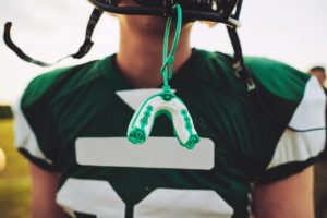 football player with mouthguard