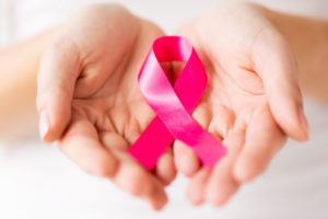 Breast cancer ribbon being held 