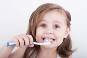 Child brushing teeth