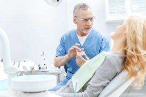 Dentist speaking to patient