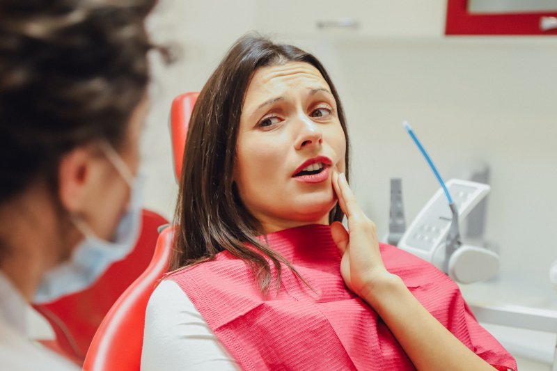 Woman with wiggly tooth