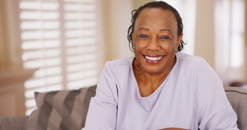 person with dentures smiling