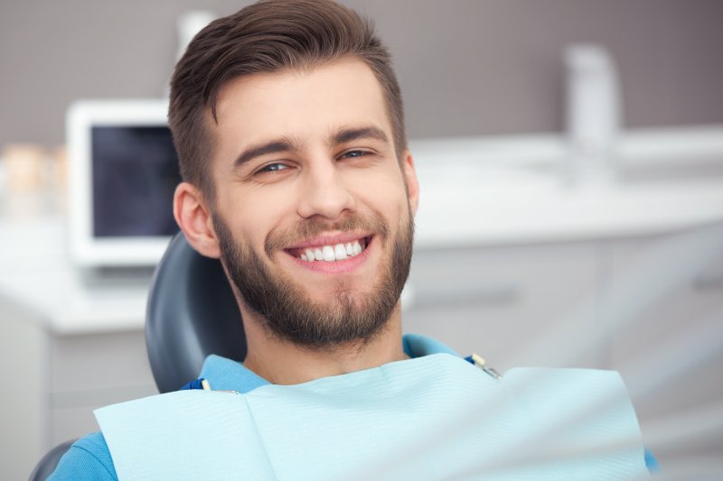 person smiling after getting dental implants