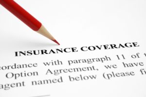 Insurance coverage policy and red pencil