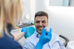 A man smiling as he prepares for Invisalign treatment