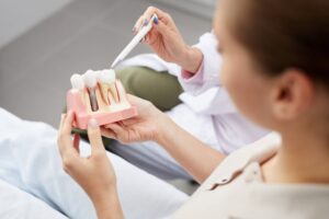 dentist explaining dental implants to a patient